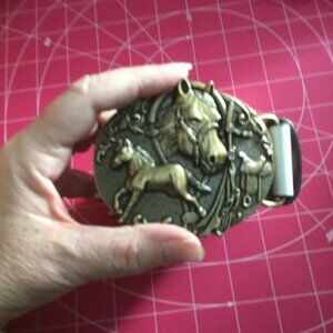 Western themed faux leather belt measures 44 inches with out the buckle